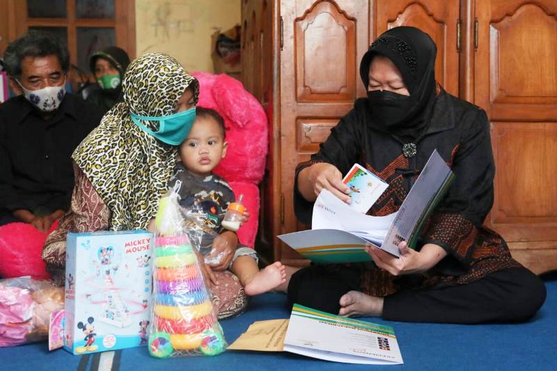 Indonesian Minister of Social Affairs Tri Rismaharini, also known as Risma (right)